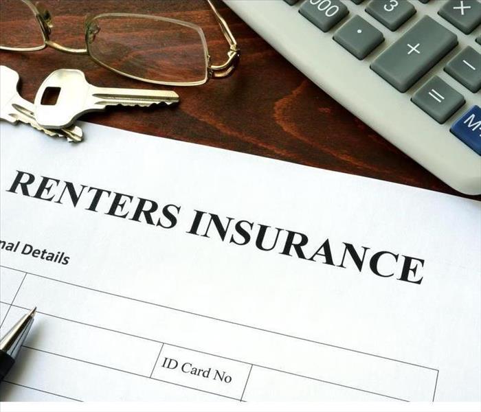 Renters insurance form and dollars on the table